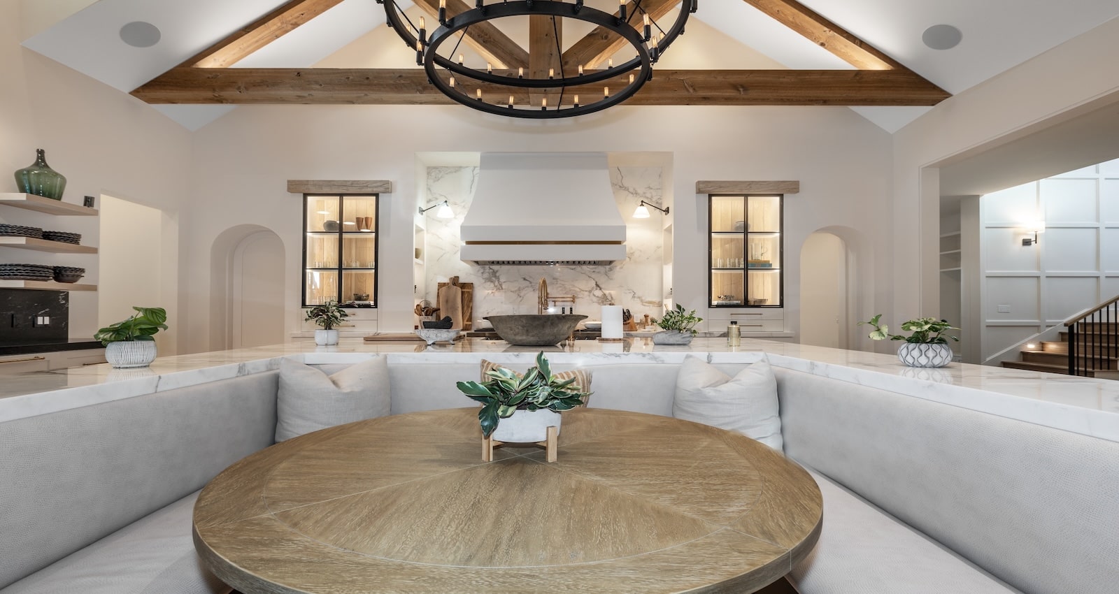 A RootCellar walk-in refrigerator sits behind double arched doors in this Orlando home. | Photo: Chris Freeman, The Freeman Company