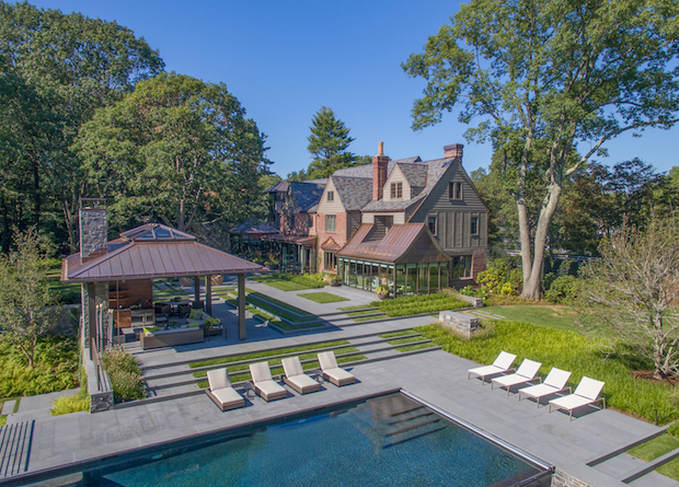 Drone_view_of_Tudor_mansion_with_pool_house