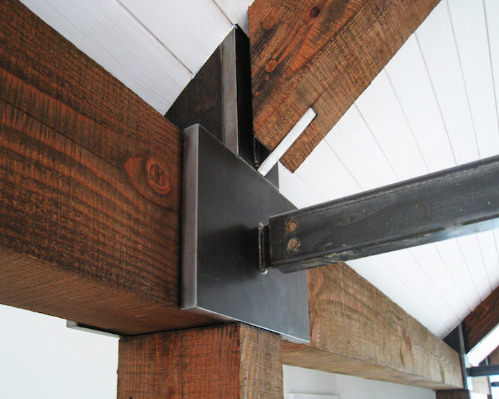 Timber and metal intersection with ceiling
