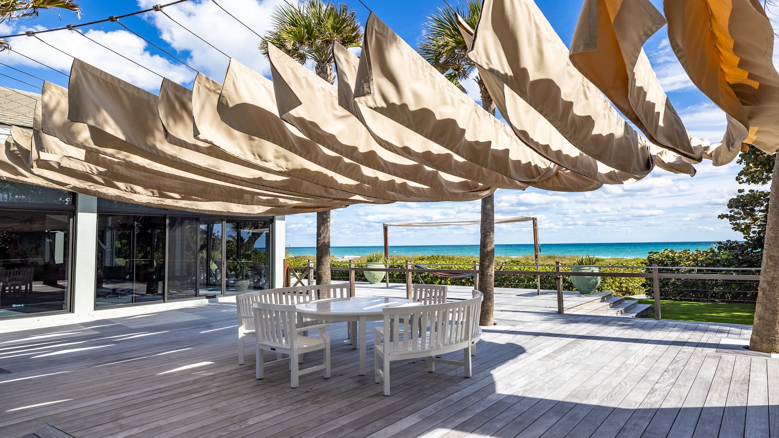 Fabric hangs over dining area to provide shade